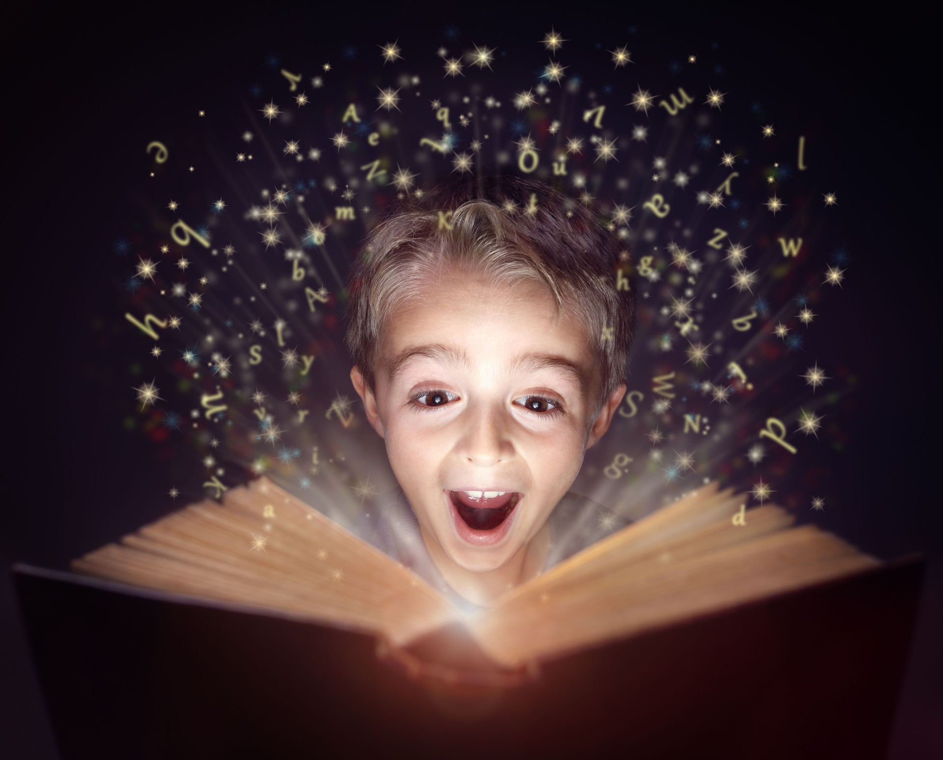 Child reading a magic story book